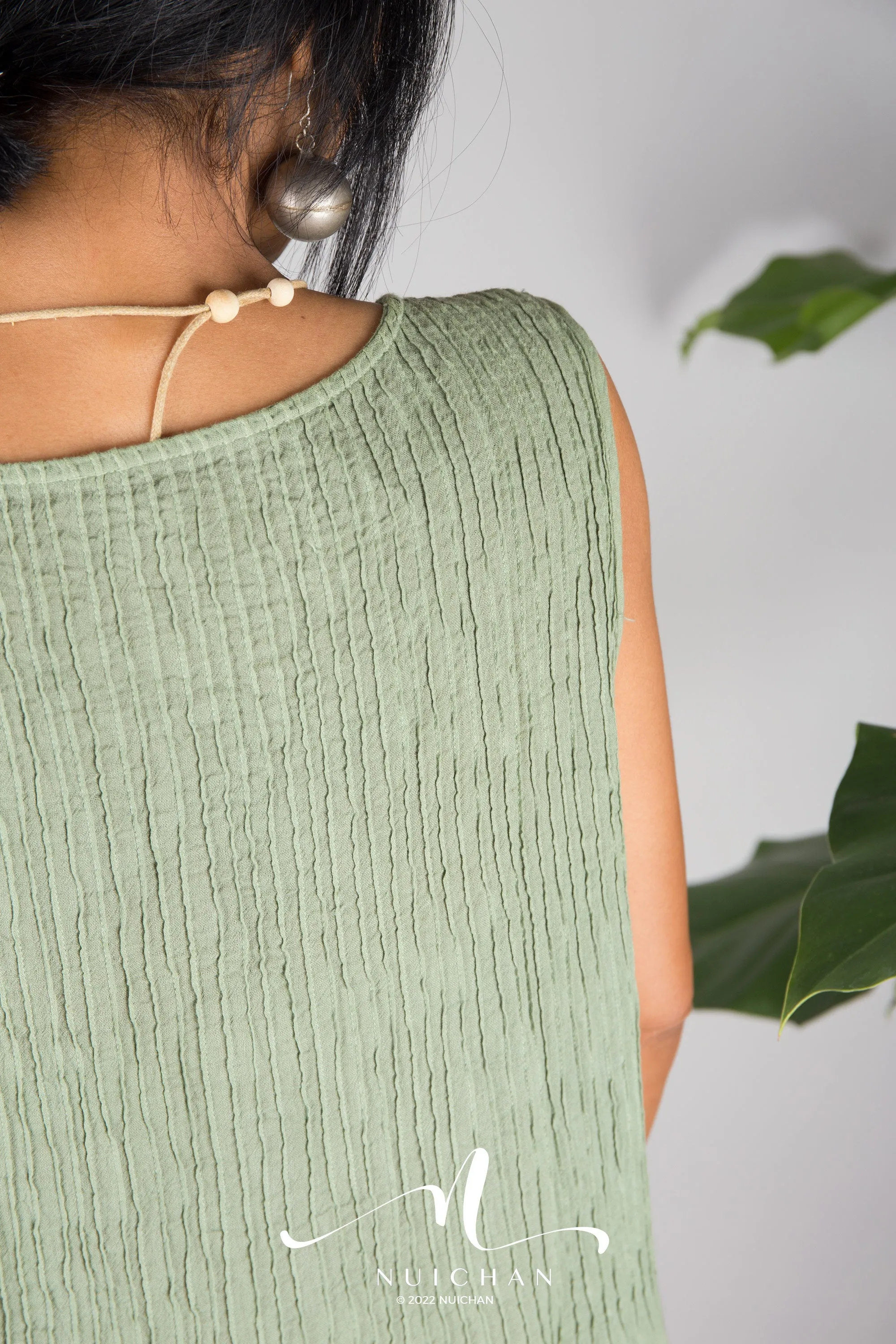 Sleeveless green cotton dress